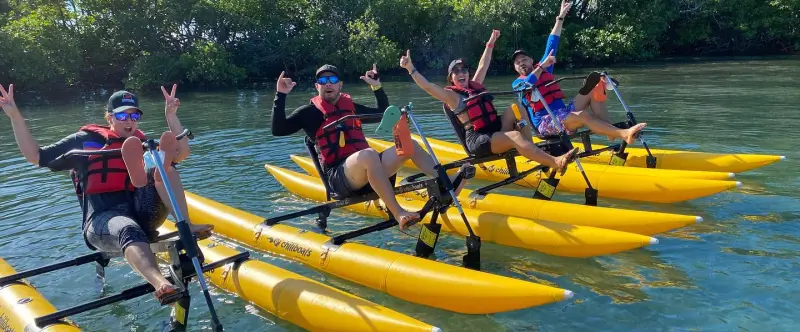 a group of people on a boat in the water