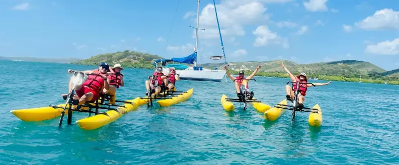 a group of people on a boat in the water
