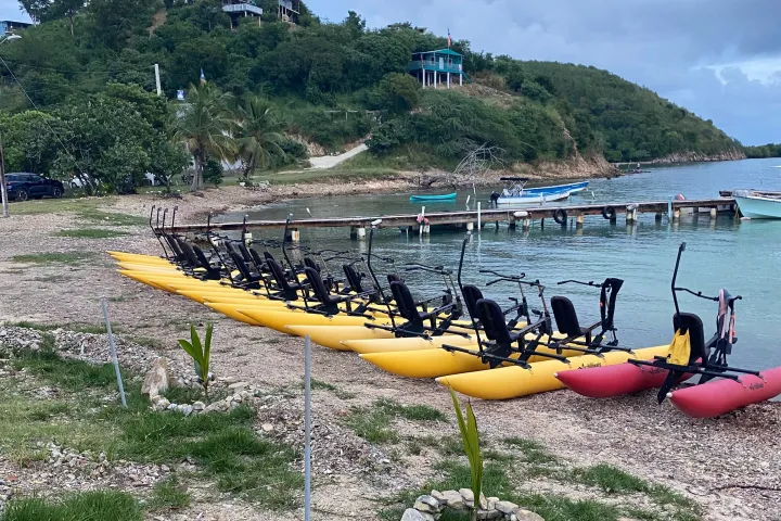 a group of people in a small boat in a body of water