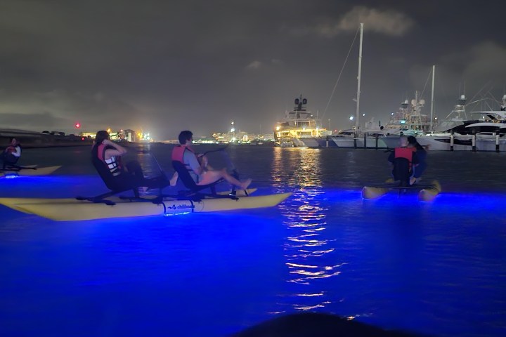 a group of people in a boat on a body of water