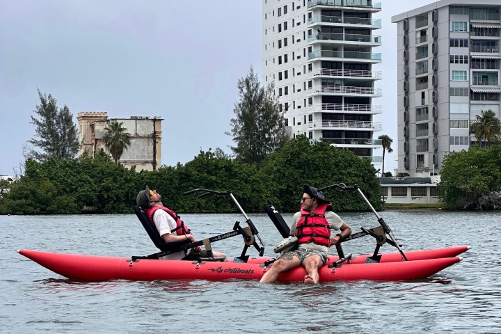 a group of people on a boat in a large body of water
