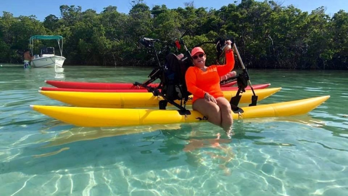a group of people in a pool of water