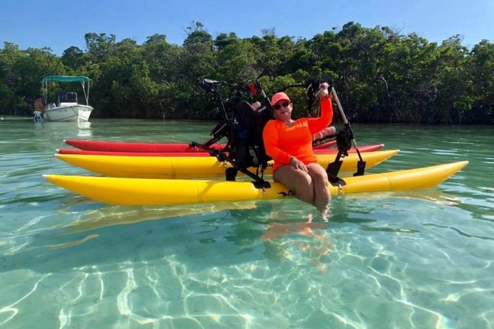a group of people in a pool of water