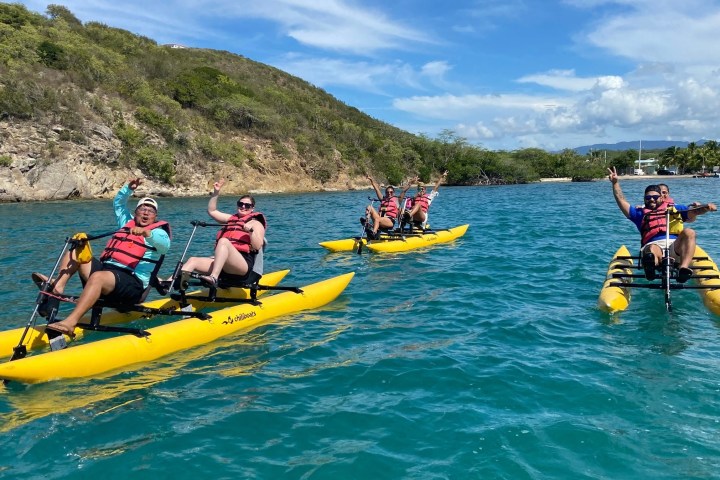 a group of people riding on a raft in a body of water