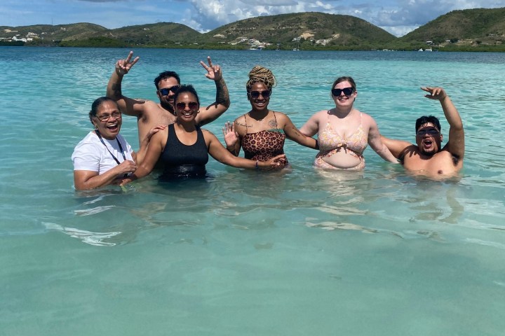 a group of people swimming in a body of water