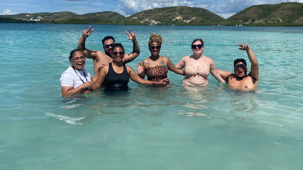 a group of people swimming in a body of water